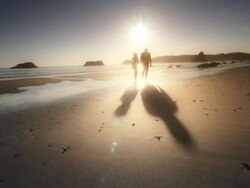 MS POV Shot of Senior couple walking on beach at sunset / Port Orford, Oregon, United States  Stock Footage
