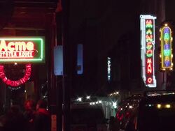 Nightlife neon outside Acme Oyster House on Bourbon Street in New Orleans Stock Footage