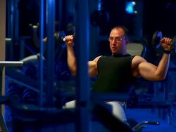 HD DOLLY: Lifting Weights In The Gym Stock Footage