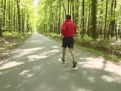 HD SUPER SLOW-MO: Running Through The Forest Stock Footage