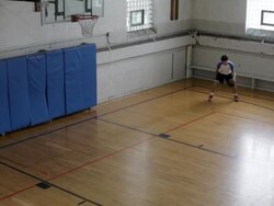 WS Young man playing basketball and practicing inside  gymnasium / Minneapolis, Minnesota, United States  Stock Footage