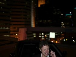 MS TD Well dressed young man standing next to his modern convertible car with confidence and talking on phone at night in urban area / Minneapolis, Minnesota, United States Stock Footage