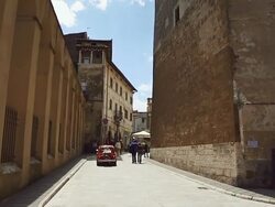 WS View of Old vintage Fiat 500 crossing square in Pitigliano Stock Footage