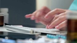 Doctor typing Stock Footage