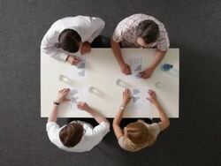 MS, four business people shaking hands after having a meeting, overhead view Stock Footage