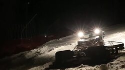 Machine for leveling the ski slopes works at night. Stock Footage
