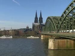 MS Shot of Rhine river with Hohenzollern Bridge and Dom (Cathedral) / Cologne, North Rhine Westphalia, Germany Stock Footage