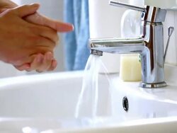 Woman washing hand over bathroom sink. Stock Footage