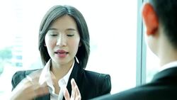 Close up shot of businesswgesoman  talking to co-worker Stock Footage