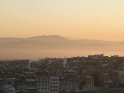 WS View of cityscape with mountains and birds flying in sky around dusk / Casablanca, Centro, Morocco Stock Footage