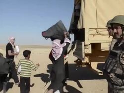 Refugees on military transport Stock Footage