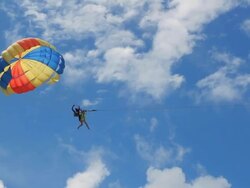 HD: Paraglider Soaring Over The Beach Stock Footage