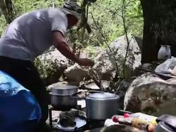 MS Man cooking lunch at camp / Durma, Banke District, Nepal Stock Footage