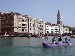 WS View of barge men's riding boats on Canal Grande near Santa Maria Della Salute / Venice, Veneto, Italy Stock Footage
