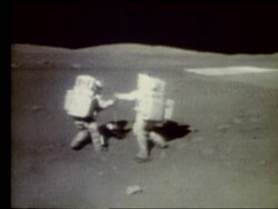 2 astronauts collecting moon rocks on Moon Stock Footage