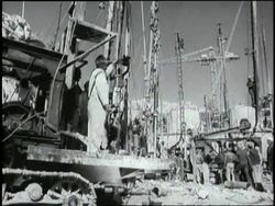 Egyptian workers build the Aswan Dam along the Nile River in Egypt. News Clip