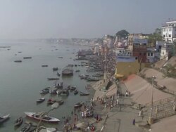 WS PAN Colorful buildings and crowds at  shoreline of river / India Stock Footage