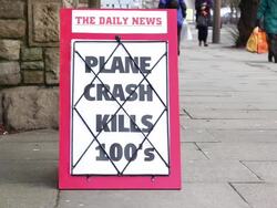 Newspaper Headline Board - Plane crash kills Hundreds Stock Footage