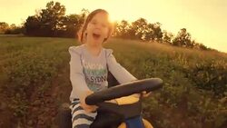 HD Image Sequence. GENDER NEUTRAL KIDS. A Happy Little Girl Drive Go-chart, Off-Road. Happy Memories Of Her Young Days Stock Footage