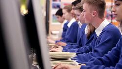 Students studying in school computer lab Stock Footage