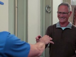 Delivery man knocking on front door, delivering parcel Stock Footage
