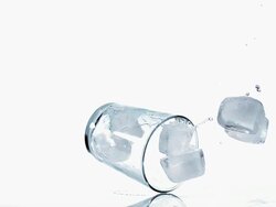 MS SLO MO Shot of falling glass with Ice Cubes / Vieux Pont, Normandy, France Stock Footage