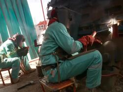 MS Shot of two men welding / Namibia Stock Footage