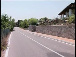 Cyclist Rasmussen leaving his house in Italy in his car News Clip