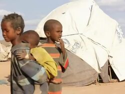Boy carrying little child on his back Stock Footage