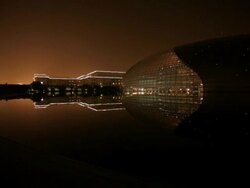WS Great Hall of the People next to National Grand Theater at night / Beijing, China Stock Footage