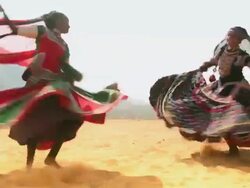Two women dancing in the desert, Rajasthan, India Stock Footage