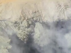 MS Shot of geyser pool with light brown rock underwater and steam passing / Geiser del Tatio, Atacama desert, Chile Stock Footage