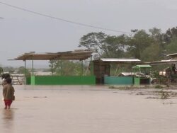 Children wade through flood waters in aftermath of typhoon Megi or Juan in the Philippines. Super Typhoon Megi or Juan, NE Luzon, Philippines Oct 2010 / AUDIO Stock Footage