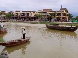 Hoi An, woman with conical hat, rowing on Thu Bon river Stock Footage