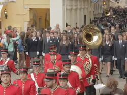 MS Red and blue band in street at easter parade AUDIO / Kerkyra, Corfu, Greece Stock Footage