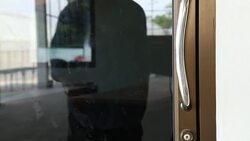 Panning shot man open door at house. Stock Footage