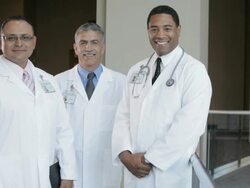 MS Three physicians standing, smiling, portrait / Seattle, Washington, USA Stock Footage
