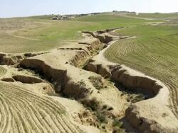 Aerial wadi Yeruham with irrigated farmland in Negev Desert, Israel Stock Footage