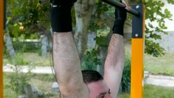 Beautiful muscular man doing street fitness gym exercises and workout routines Stock Footage