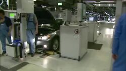 Several employees work at various assembly lines in a BMW factory. Stock Footage