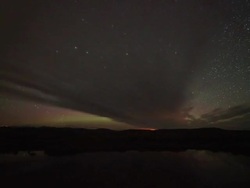 WS T/L View of milky way reflection in lake during  dusk to dawn /Ringebu, Norway Stock Footage