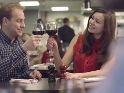 MS PAN Senior man giving gift to woman in restaurant Stock Footage