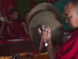 MS ZO Man monk crashing symbols in Buddhist monastery  with young Buddhist monks / Kathmandu, Central Region,Nepal Stock Footage