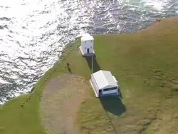 MS AERIAL DS View of Latrabjarg Lighthouse and peninsula / Iceland Stock Footage