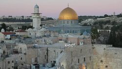 The golden roof of the Dome of the Rock contrasts with the surrounding stone buildings. Stock Footage