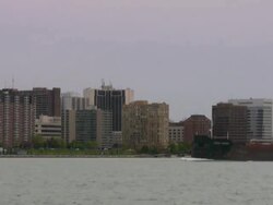Great Lakes Freighter on Detroit River (Michigan). Windsor, Canada background. Stock Footage