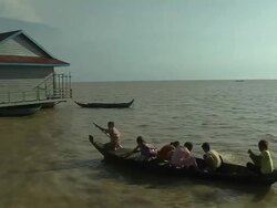 Passing Shot Kids in Boat Tonlesap Lake Siem Reap Cambodia Stock Footage