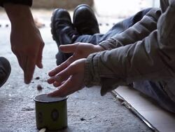 HD SLOW-MOTION: Giving Change To A Begging Homeless Stock Footage