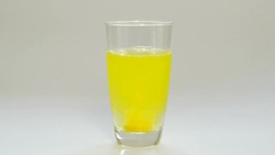 Effervescent Tablet filled in a water galss until change color from Stock Footage