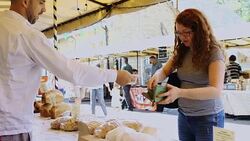 Buying Bread at Farmers Market Stock Footage
